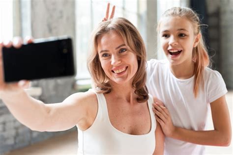 nude mother daughter|Mom taking a secret selfie gets caught in the act by her nosey。